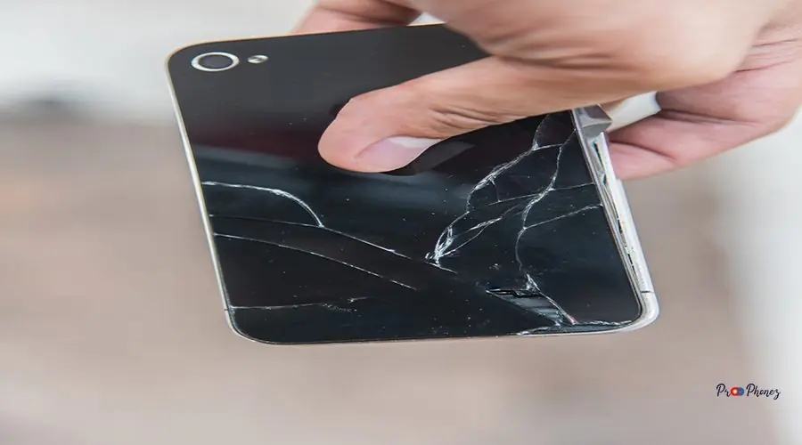 Broken phone with a cracked screen. Broken phone with a cracked screen.