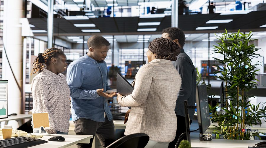 Business associates reviewing objectives data and performance metrics in a modern office, focusing on corporate strategy and decision making for sustainable enterprise development.
