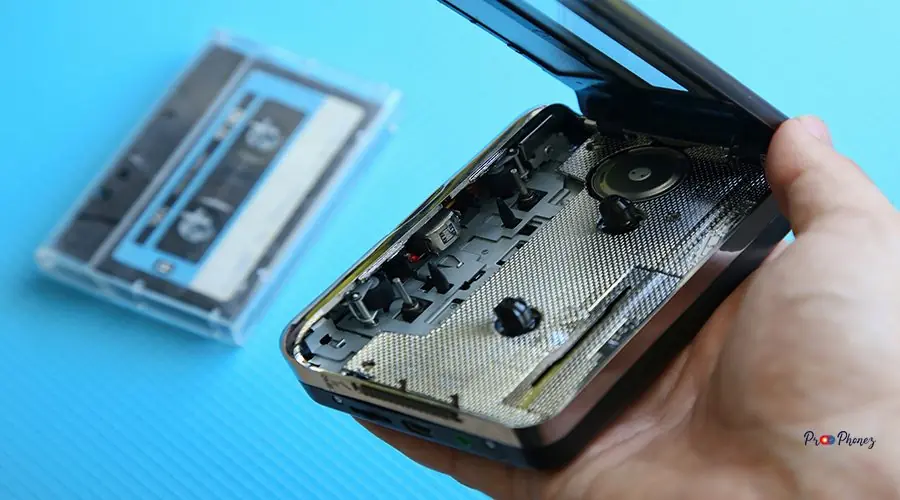 close-up-hand-holding-tape-recorder close-up-hand-holding-tape-recorder