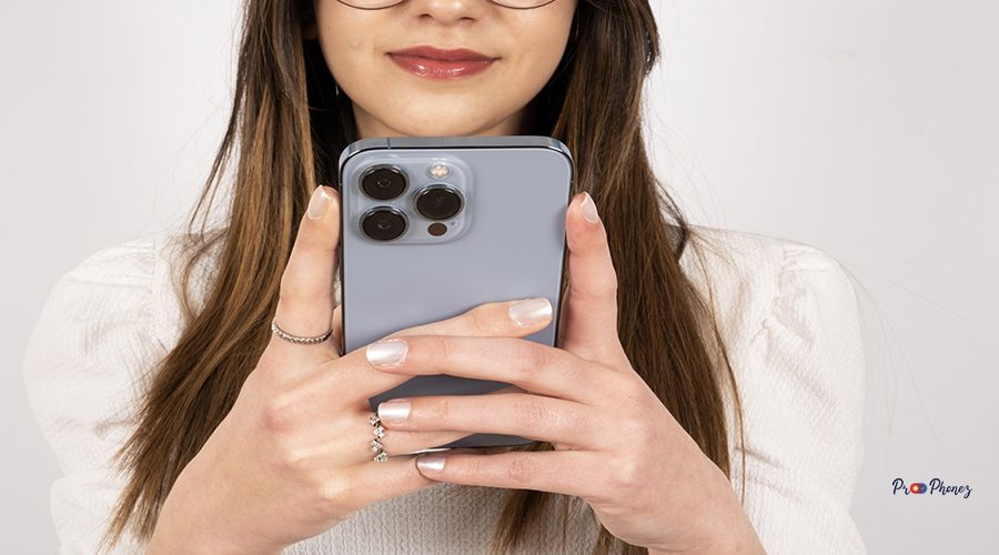 close-up-image-young-woman-using-smartphone-holding-mobile-phone-with-two-hands