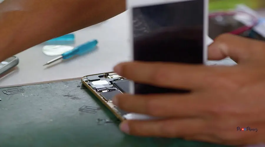 close-up-person-hands-repairing-mobile-phone close-up-person-hands-repairing-mobile-phone