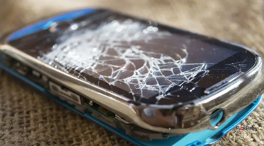 broken screen of a smartphone blue smartphone with broken glass of the screen
