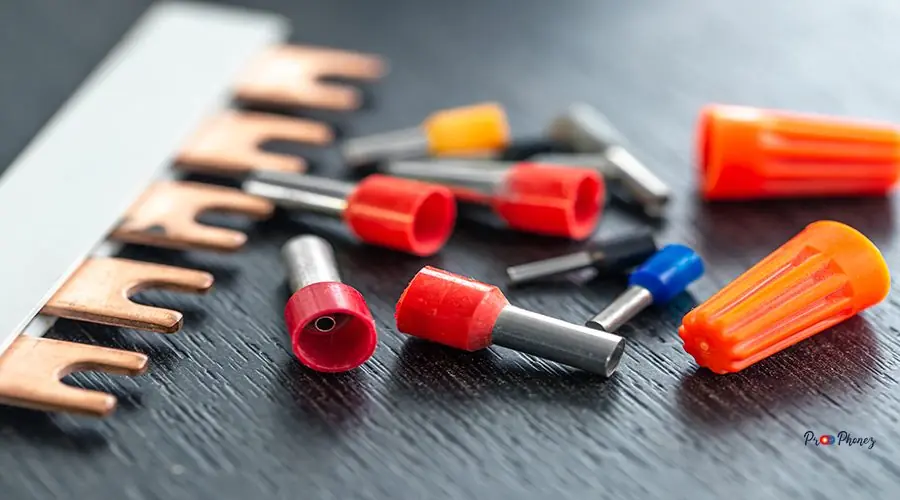 Coloured sleeves, crimp terminals for different wire sizes. Coloured sleeves, crimp terminals for different wire sizes. Copper sleeves for crimping electrical cables. Ferrules. Selective focus.