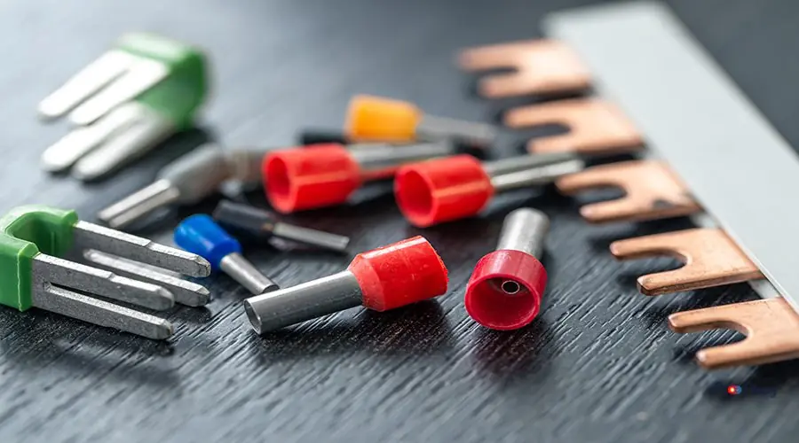 Coloured sleeves, crimp terminals for different wire sizes. Coloured sleeves, crimp terminals for different wire sizes. Copper sleeves for crimping electrical cables. Ferrules. Selective focus.