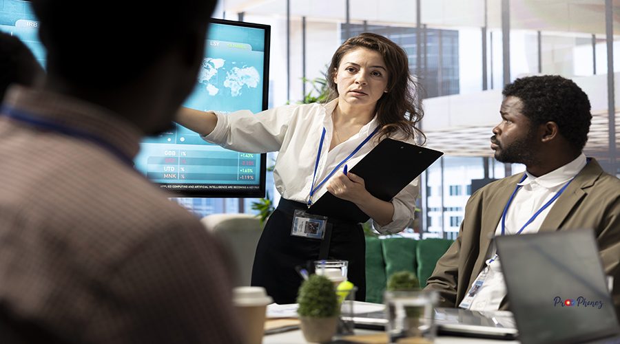 Corporate associates looking into project details and timetables in conference room, establishing budget and operations to accomplish objectives in a competitive business environment.