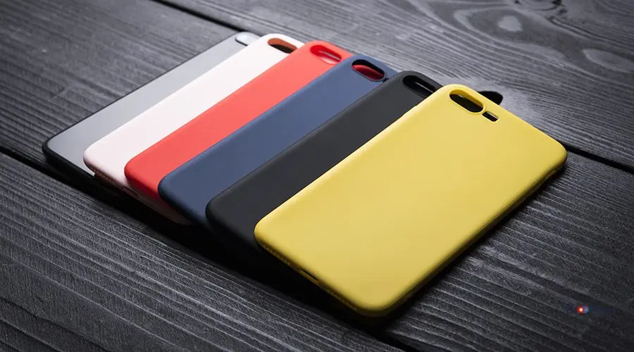 different-colour-phone-cases-black-woden-background different-colour-phone-cases-black-woden-background