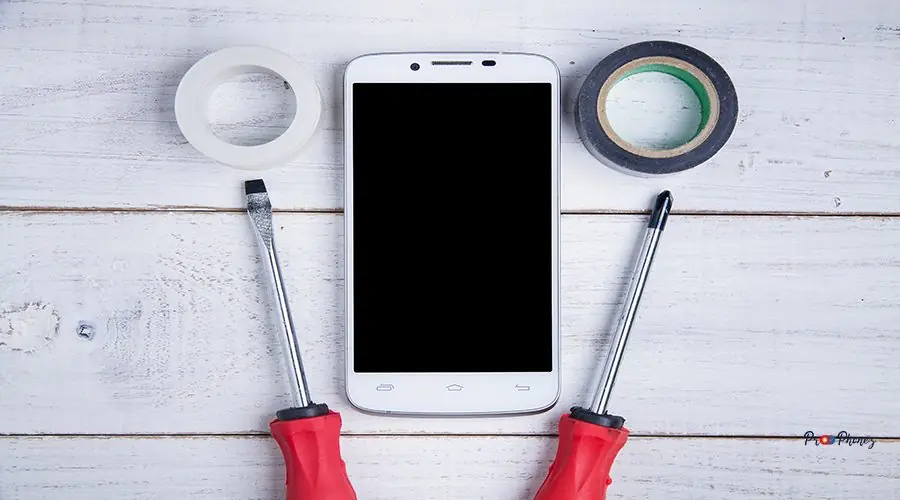 smartphone and equipment repair on the white wooden background. smartphone and equipment repair on the white wooden background