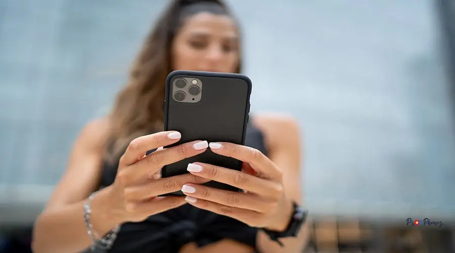 Female holding a phone A female holding a phone