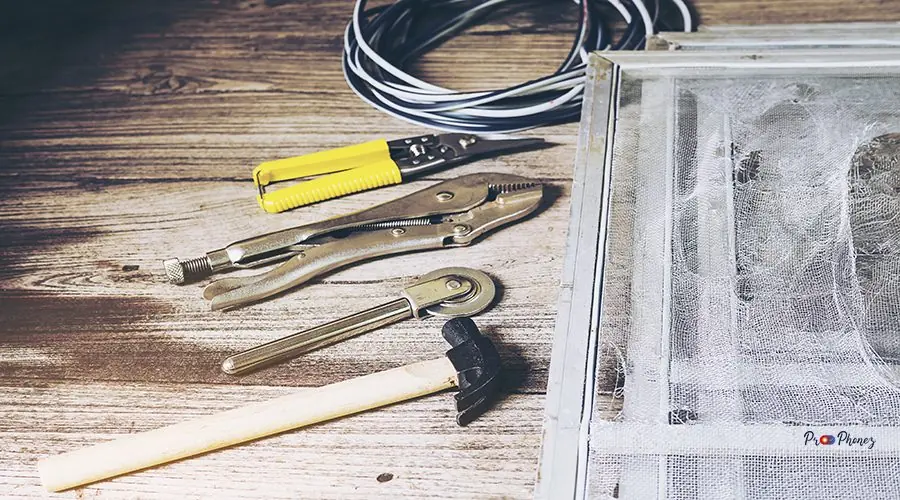 Hand tools set and damaged mosquito wire screen which need to be Hand tools set and damaged mosquito wire screen which need to be fixed
