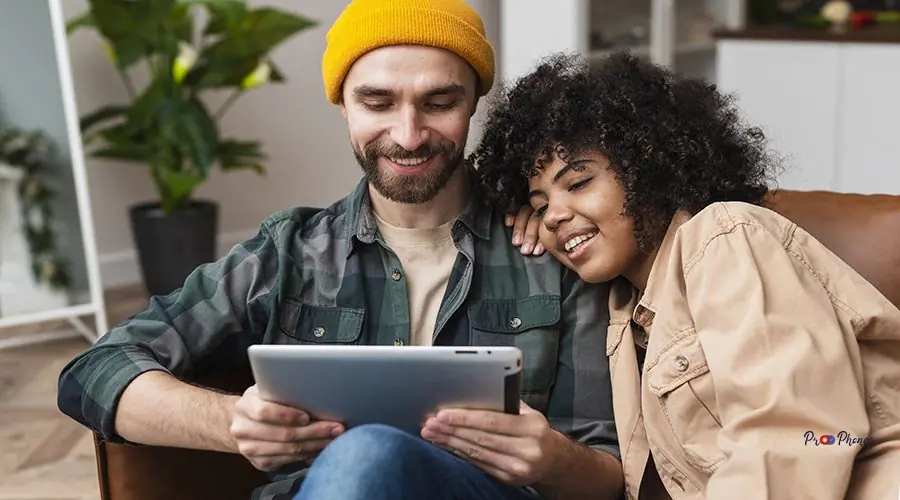 happy-hipster-couple-looking-tablet happy-hipster-couple-looking-tablet