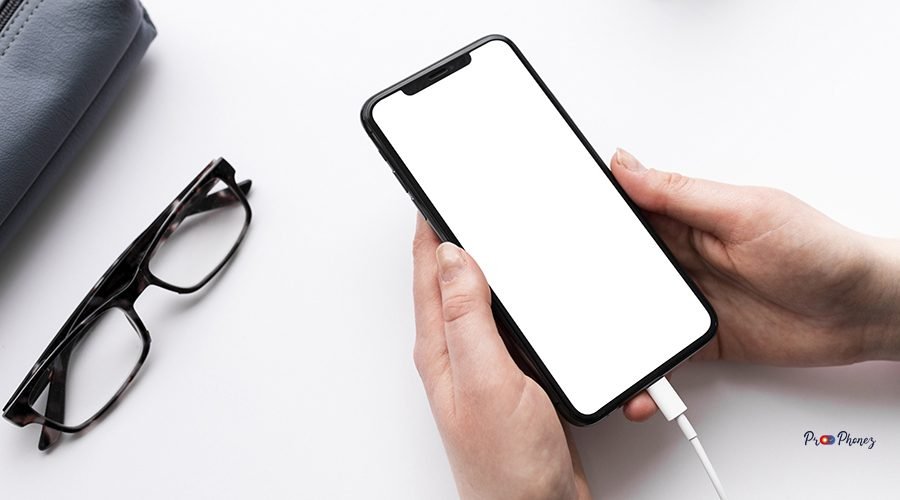 high-angle-person-holding-empty-display-phone