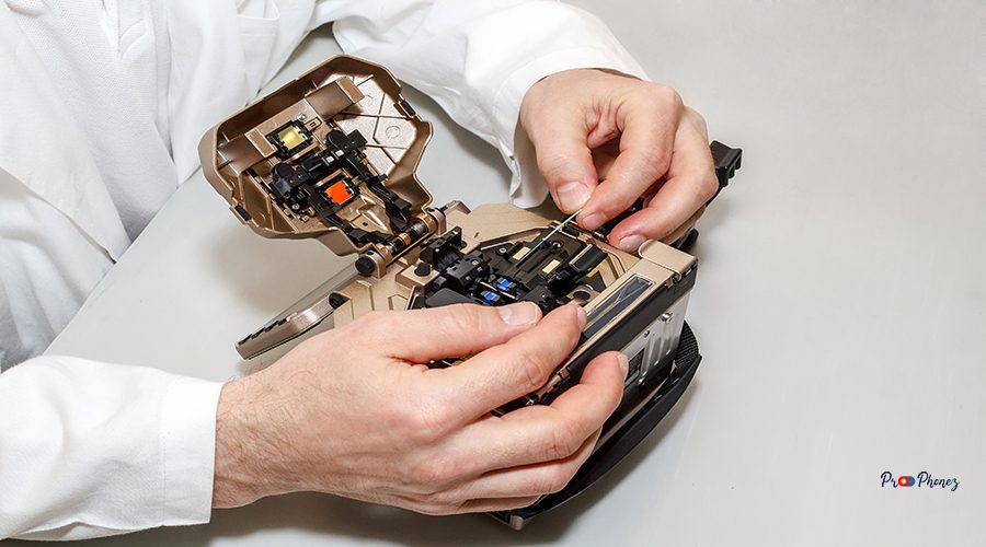 working with fiber optic fusion splicer in laboratory