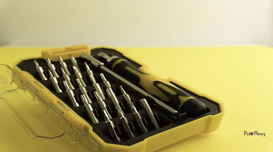 Interchangeable screwdriver set with different types of metal st Interchangeable screwdriver set with different types of metal steel heads and bits. Isolated on white background.