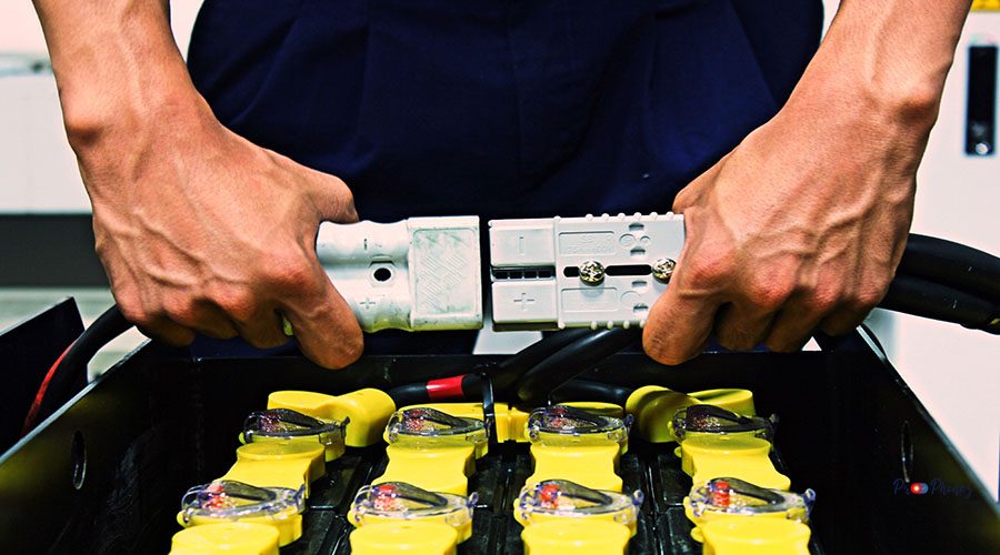 midsection-worker-holding-tools