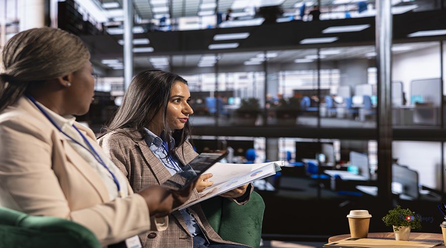 Multiethnic women leaders in a business meeting brainstorming marketing strategies searching for organizational expansion opportunities. Professionals shaping corporate culture and equal rights.