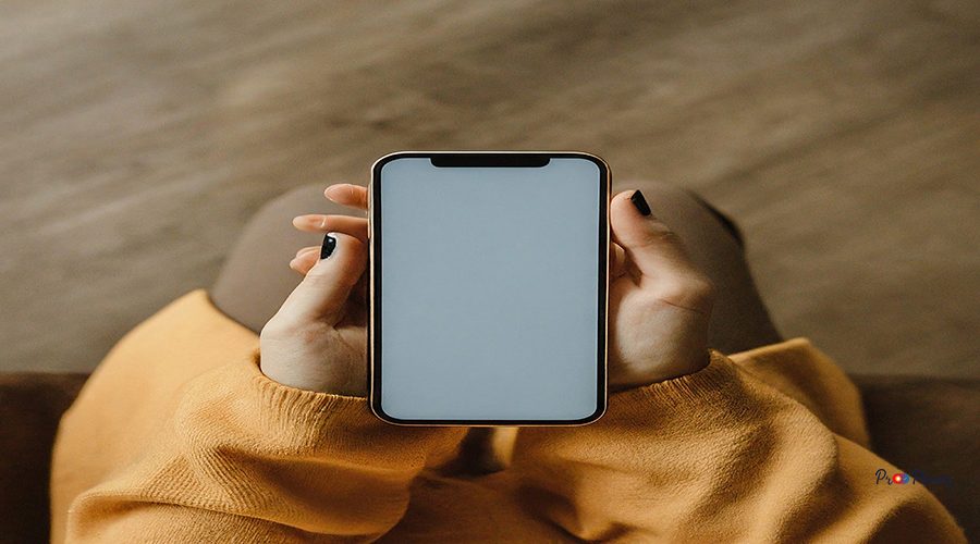 person-is-holding-phone-with-white-screen-that-says-iphone_1