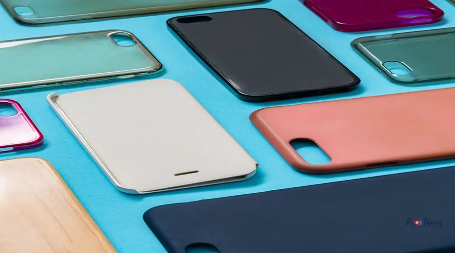 Pile of multicolored plastic back covers for mobile phone. Choic Pile of multicolored plastic back covers for mobile phone. Choice of smart phone protector accessories on blue background. A lot of silicone phone backs or skins next to each other