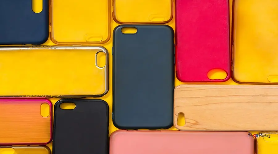 Pile of multicolored plastic back covers for mobile phone. Choic Pile of multicolored plastic back covers for mobile phone. Choice of smart phone protector accessories on yellow background. A lot of silicone phone backs or skins next to each other