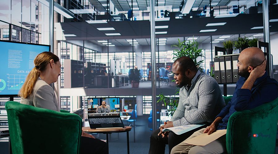 Remote briefing meeting between diverse business people in strategic partnership, emphasizing leadership skills and agenda development. Consulting investors on web video call. Camera A.