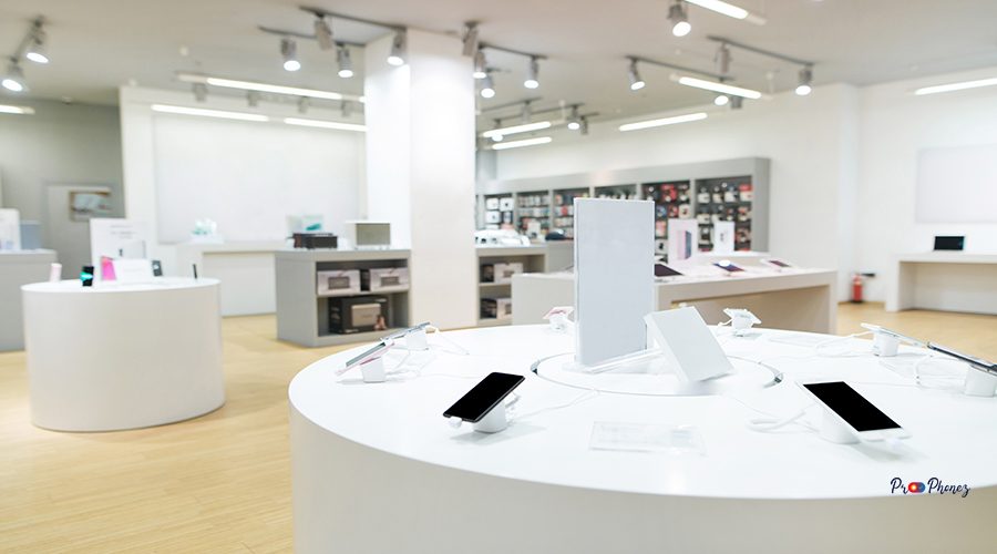 Showcase with smartphones in the background of technology store.