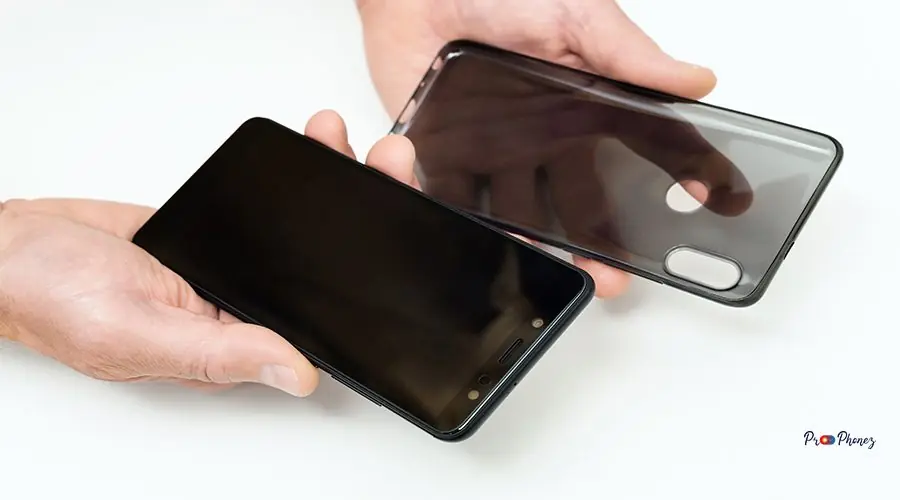 Smartphone and silicone case in human hands. iphone 13 back glass replacement