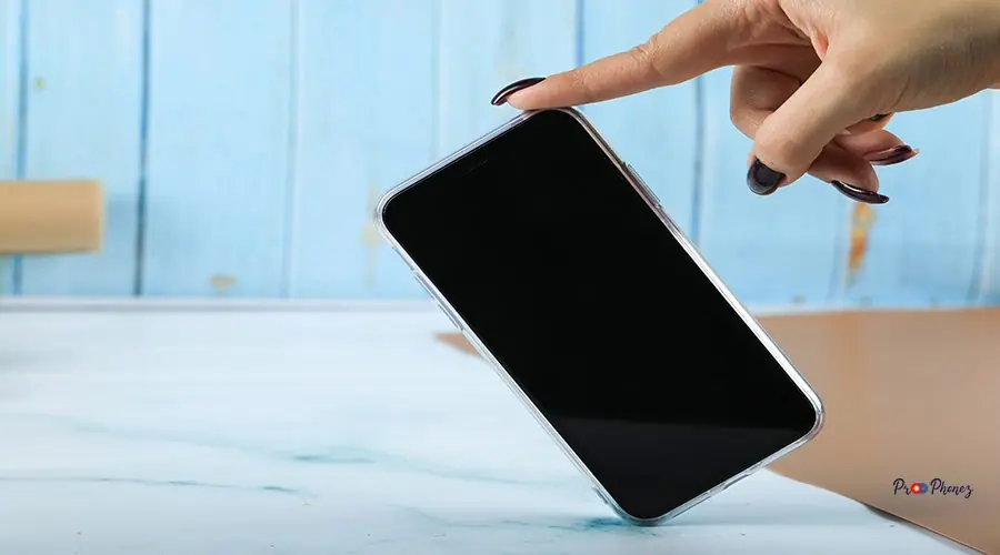 Taking a black mobile phone with a finger iPhone Screen