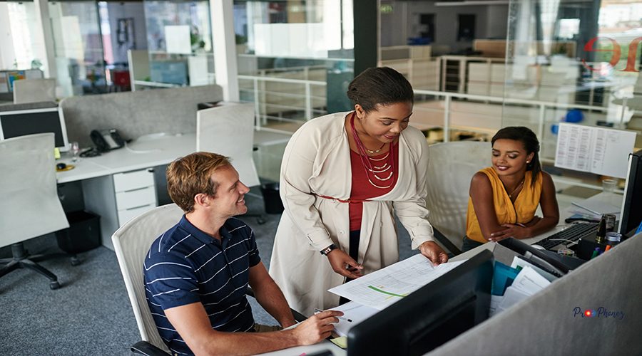 Shot of three colleagues having a meeting in an office.
