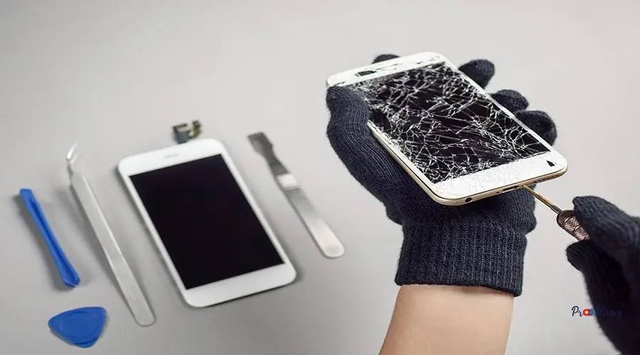 Technician repairing broken smartphone on desk iPhone Screen