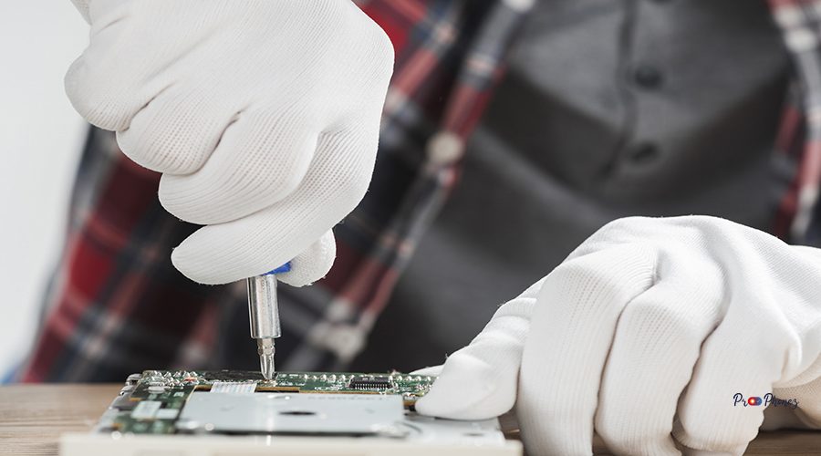 technician-repairing-computer-motherboard-with-screwdriver