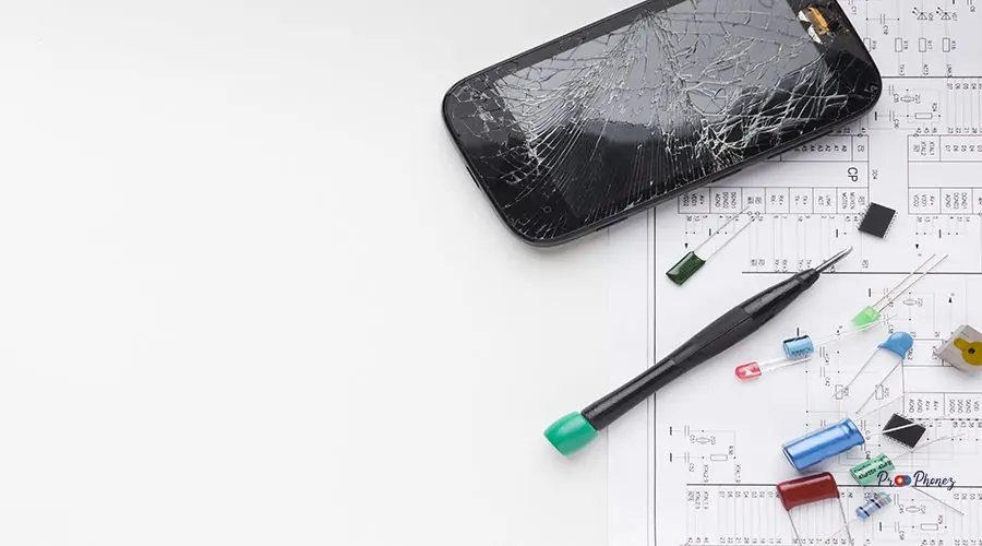 top-view-broken-phone-with-electronic-components top-view-broken-phone-with-electronic-components
